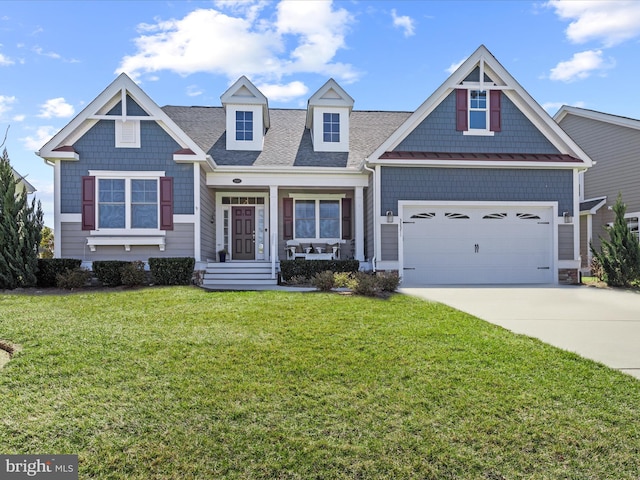 view of front facade with a garage, concrete driveway, a shingled roof, and a front lawn