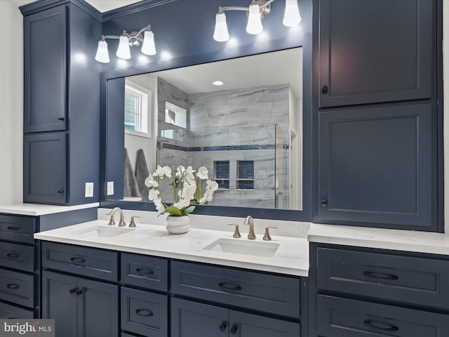 bathroom with double vanity, a sink, and a shower stall