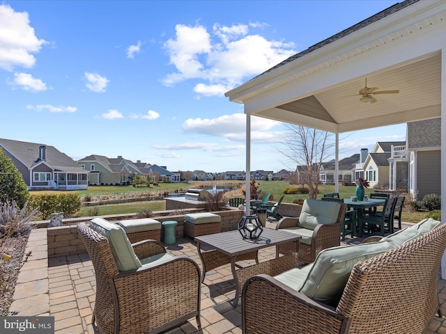 view of patio featuring a ceiling fan, a residential view, outdoor dining area, and outdoor lounge area