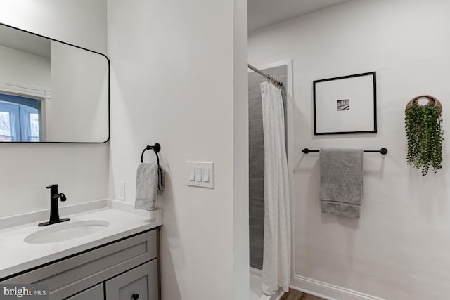 full bath with a shower with curtain and vanity