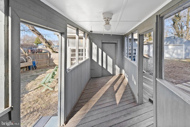 sunroom featuring plenty of natural light and ceiling fan