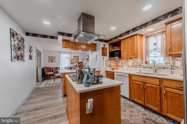 701 Paris Kirby Rd, Milford, DE 19963 - kitchen featuring a sink, island range hood, dishwasher, a center island, and backsplash