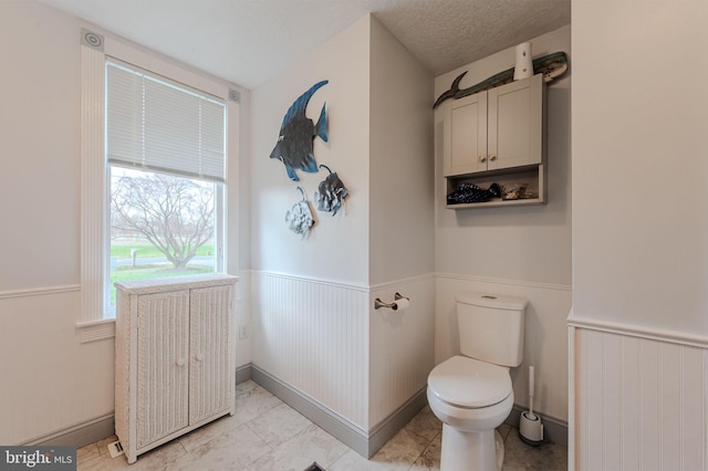 701 Paris Kirby Rd, Milford, DE 19963 - bathroom with a wainscoted wall and toilet
