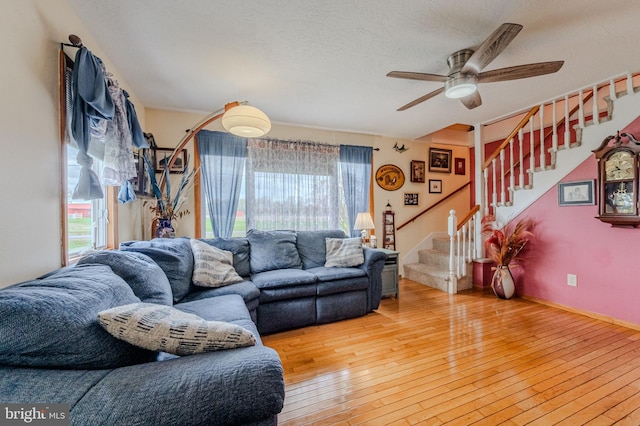 701 Paris Kirby Rd, Milford, DE 19963 - living area featuring plenty of natural light, ceiling fan, stairway, and light wood finished floors