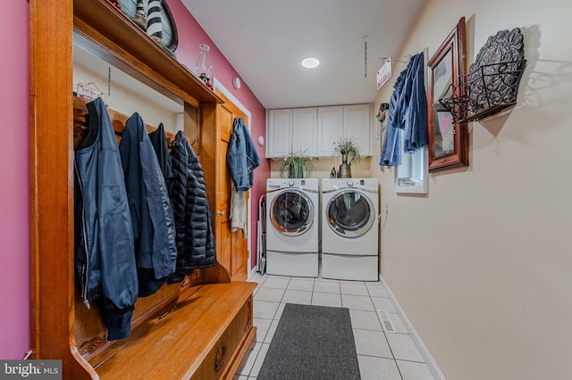 701 Paris Kirby Rd, Milford, DE 19963 - laundry room with independent washer and dryer, light tile patterned floors, cabinet space, and baseboards