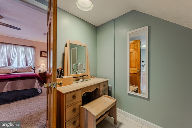 701 Paris Kirby Rd, Milford, DE 19963 - bathroom with lofted ceiling, ensuite bath, tile patterned flooring, a ceiling fan, and baseboards