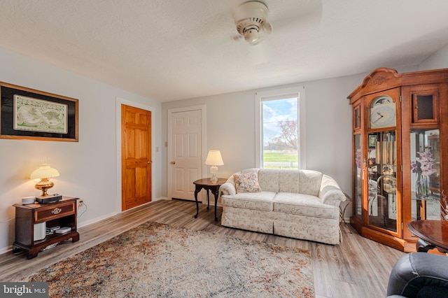701 Paris Kirby Rd, Milford, DE 19963 - living room featuring ceiling fan, wood finished floors, and baseboards