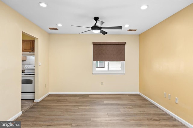 empty room featuring baseboards, recessed lighting, visible vents, and light wood-style floors