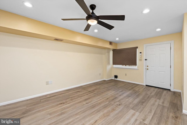 interior space featuring light wood-type flooring, visible vents, baseboards, and recessed lighting