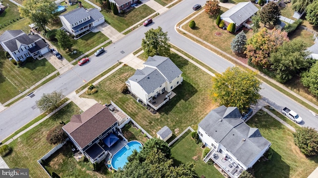 birds eye view of property with a residential view