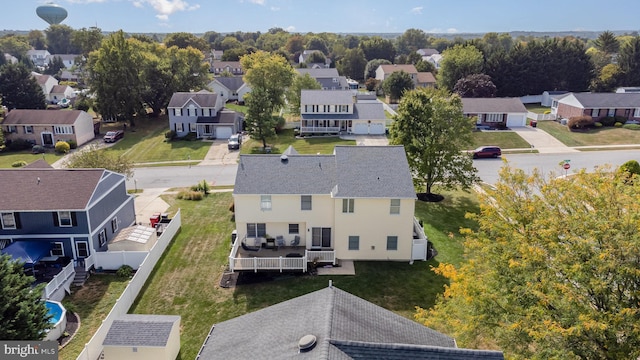 birds eye view of property with a residential view