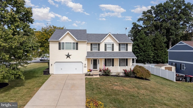 traditional-style home with driveway, roof with shingles, fence, a porch, and a front yard