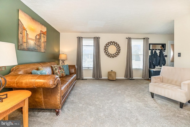 living room with carpet and baseboards