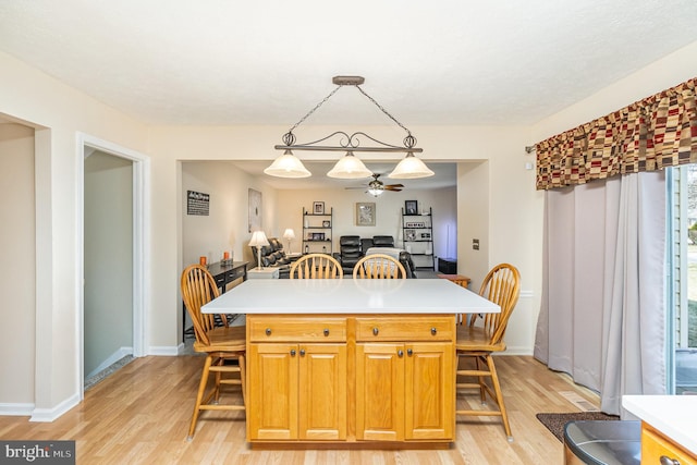 dining room with light wood-style floors and baseboards