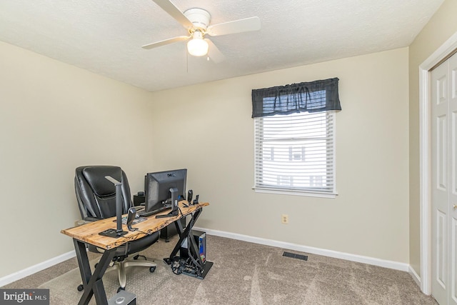 office area featuring carpet floors, visible vents, and baseboards