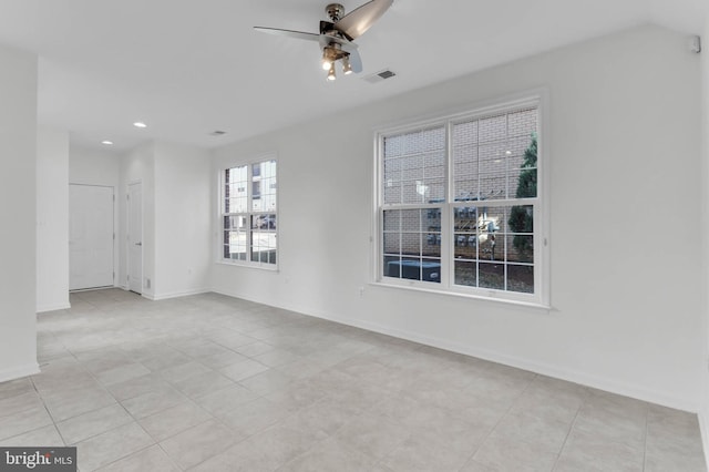 spare room with baseboards, recessed lighting, visible vents, and a ceiling fan