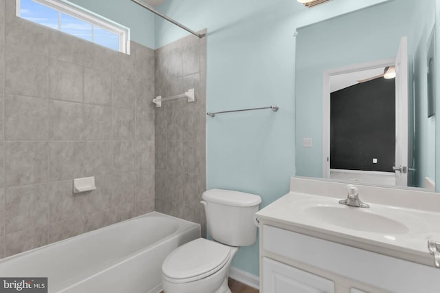 bathroom featuring shower / washtub combination, vanity, and toilet