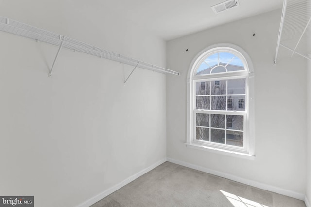 walk in closet featuring carpet floors and visible vents