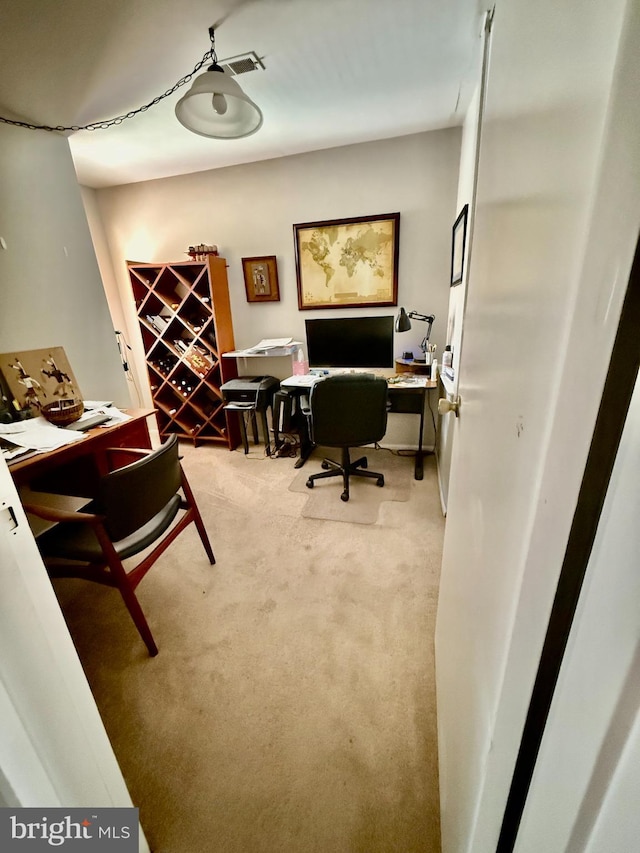 carpeted home office featuring visible vents