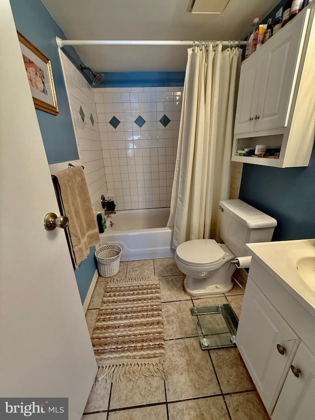 bathroom featuring tile patterned flooring, shower / tub combo with curtain, vanity, and toilet