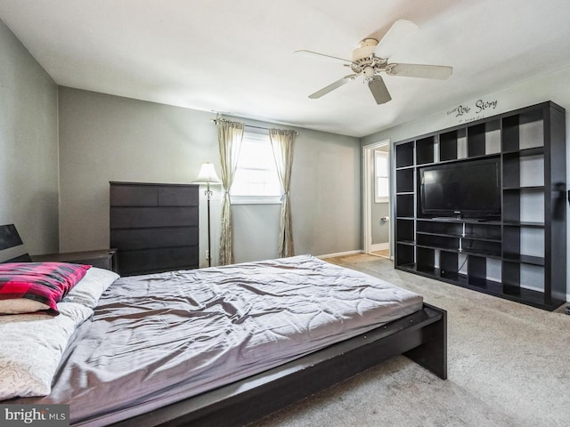 carpeted bedroom with a ceiling fan