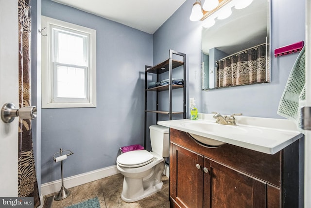 full bathroom featuring visible vents, toilet, vanity, tile patterned flooring, and baseboards