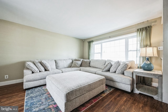 living room with dark wood-style flooring and baseboards