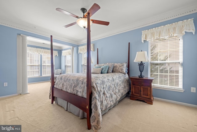 bedroom with carpet flooring, baseboards, decorative columns, and ornamental molding