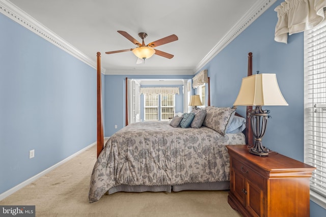 bedroom with light colored carpet, a ceiling fan, baseboards, and ornamental molding