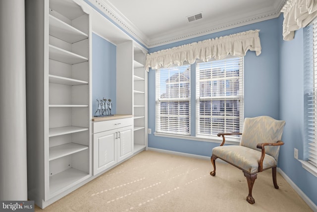 living area featuring visible vents, baseboards, light colored carpet, and crown molding