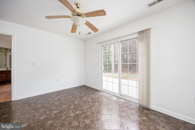 unfurnished room with visible vents, baseboards, and a ceiling fan