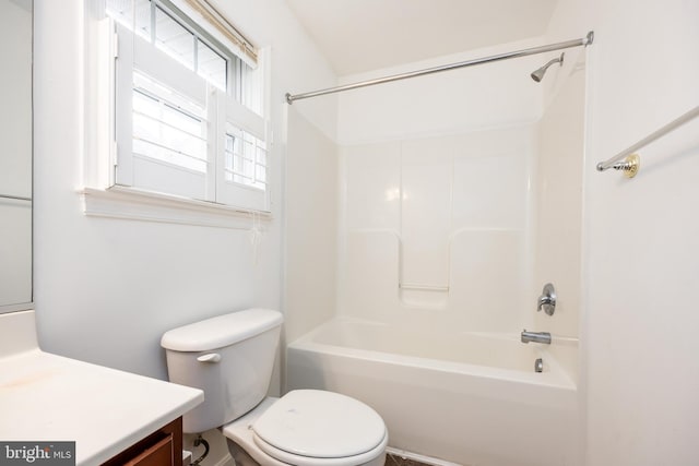 bathroom with bathing tub / shower combination, toilet, and vanity