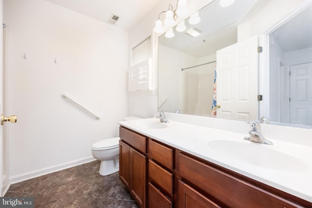 full bath with a sink, visible vents, toilet, and double vanity