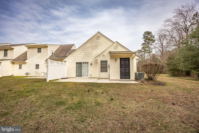 back of property featuring a yard, fence, central AC, and a patio area