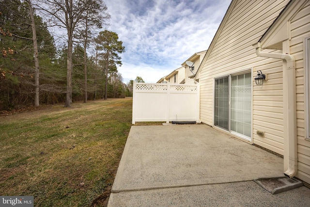 view of yard featuring a patio area and fence