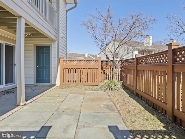 view of patio / terrace featuring fence