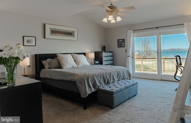 bedroom featuring lofted ceiling, ceiling fan, carpet floors, a water view, and access to exterior