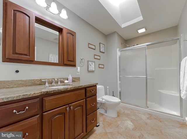 full bath featuring vanity, a shower stall, and toilet