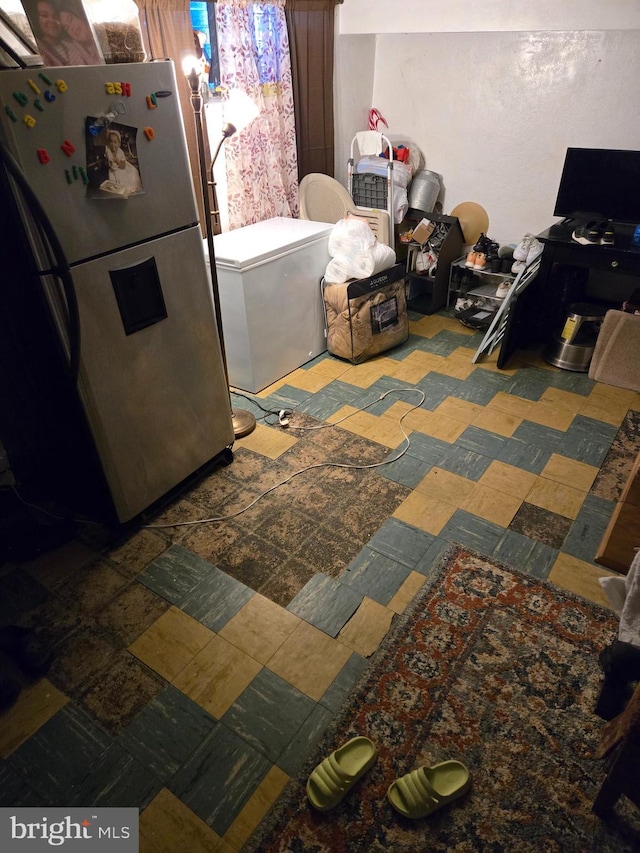 interior space featuring refrigerator and freestanding refrigerator