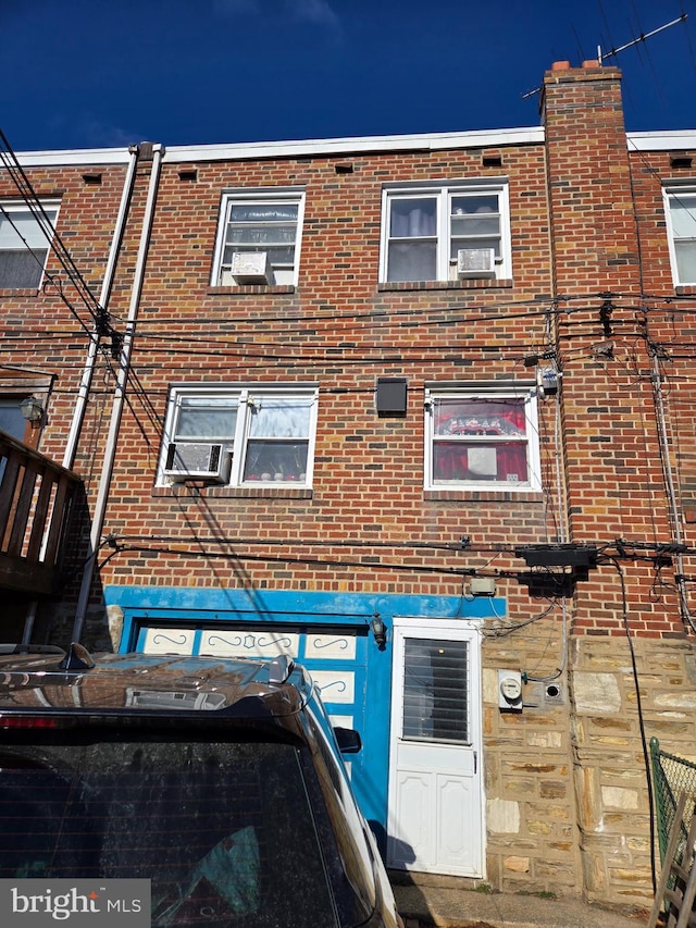 view of front of home featuring brick siding