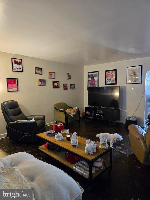 living room featuring baseboards