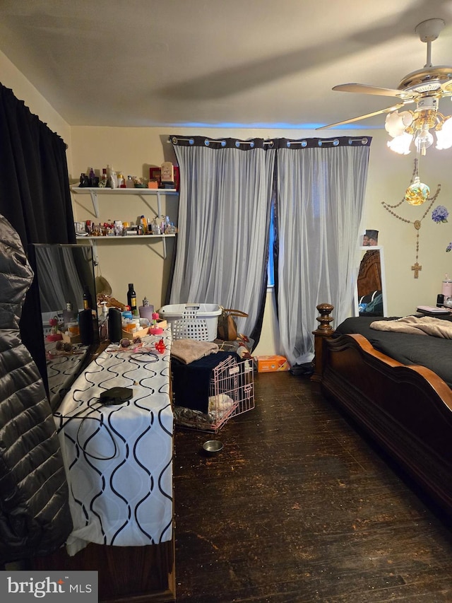 bedroom featuring a ceiling fan and wood finished floors