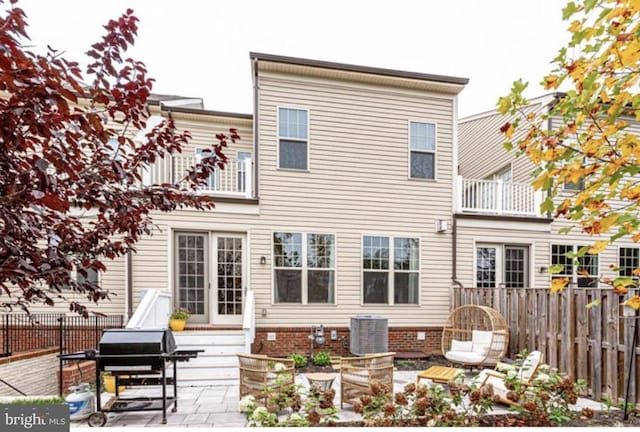 42578 Dreamweaver Dr, Brambleton, VA 20148 - back of property with fence, cooling unit, and a patio area