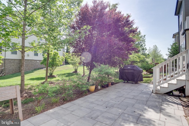 42578 Dreamweaver Dr, Brambleton, VA 20148 - view of patio featuring grilling area and stairway
