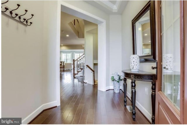 42578 Dreamweaver Dr, Brambleton, VA 20148 - hallway with stairs, dark wood-style flooring, baseboards, and recessed lighting