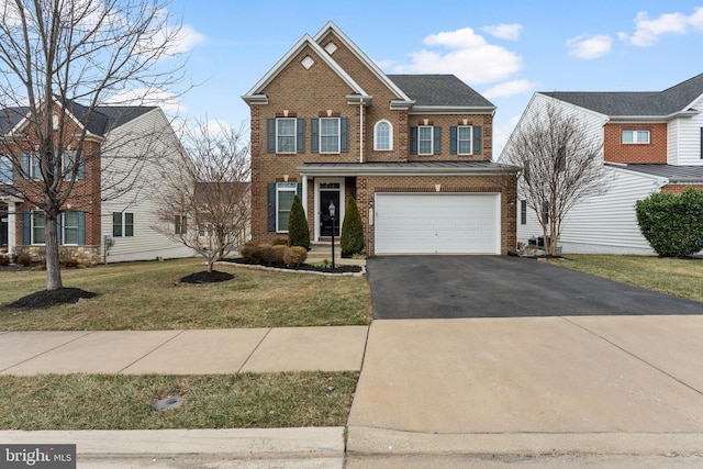 view of front of property with brick siding, driveway, a front lawn, and a garage