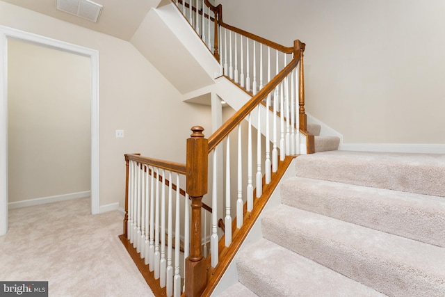 stairs featuring visible vents, carpet flooring, and baseboards