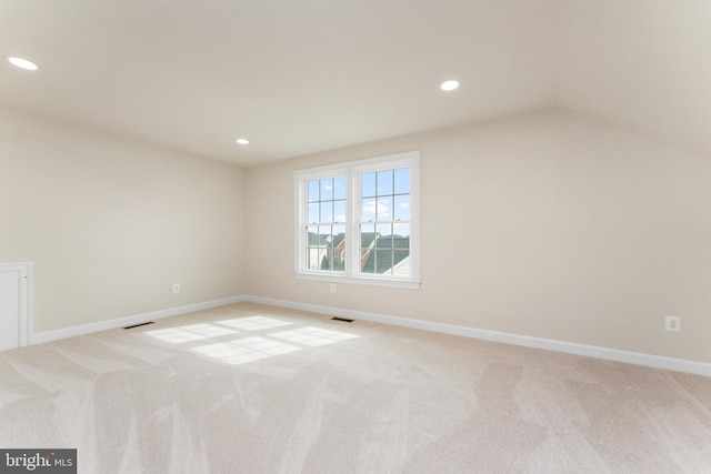 unfurnished room featuring recessed lighting, light colored carpet, visible vents, and baseboards