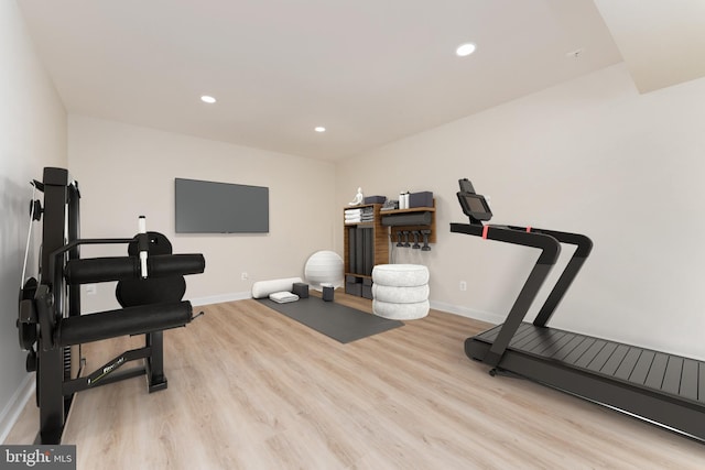 exercise area with recessed lighting, baseboards, and wood finished floors