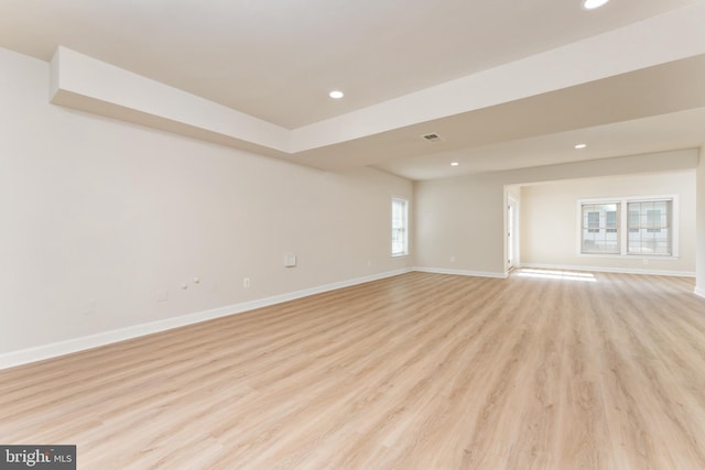 empty room featuring recessed lighting, visible vents, baseboards, and light wood-style floors